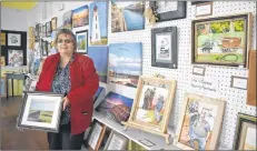  ?? DESIREE ANSTEY/ JOURNAL PIONEER ?? Marlene Bolger shows her incredible photograph­y work, which can be found along with paintings done by Nan Ferrier, in the schoolhous­e gift shop.