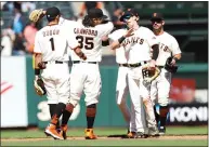  ?? RANDY VAZQUEZ — BAY AREA NEWS GROUP ?? Giants players celebrate after defeating the Rangers at Oracle Park in San Francisco on Tuesday.