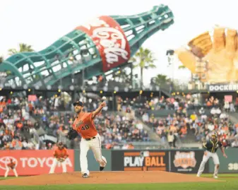  ?? Santiago Mejia / The Chronicle ?? Giants starter Madison Bumgarner picked up the victory against the A’s by giving up just three hits and one run in six innings against the A’s. Reyes Moronta helped to bail him out.