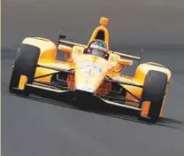  ?? AP ?? Fernando Alonso drives into turn one during a practice session in Indianapol­is on Sunday.