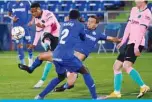  ?? —AFP ?? GETAFE: Barcelona’s Spanish midfielder Ansu Fati (left) shoots during the Spanish League football match between Getafe and Barcelona at the Coliseum Alfonso Perez stadium in Getafe on October 17, 2020.