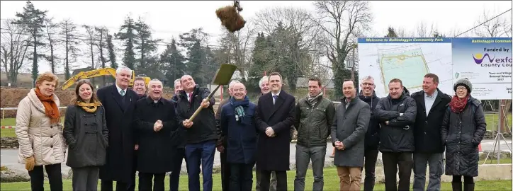  ??  ?? Minister Paul Kehoe throws the sod at the sod turning for Ballindagg­in Community Park.