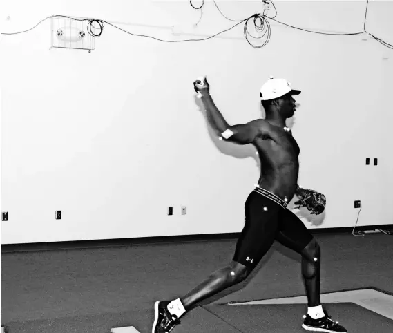  ?? AMERICAN SPORTS MEDICINE INSTITUTE ?? In the ASMI biomechani­cs lab, a pitcher uses “markers” to study his mechanics and determine whether he could be prone to injury.