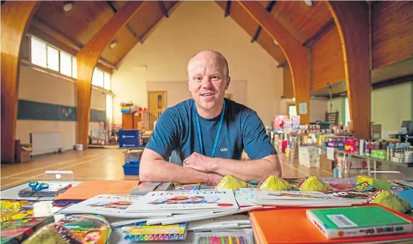  ??  ?? Ross Clark in the church hall where food parcels and ‘boredom bags’ are put together.