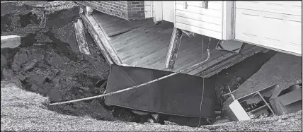  ?? SaLtWiRE nEtWoRK FiLE PHoto ?? A sinkhole “swallowed” a two-storey home in Falmouth on Sunday.