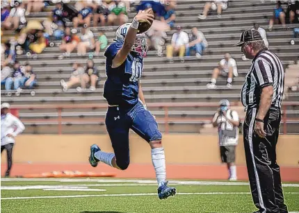  ?? ROBERTO E. ROSALES/JOURNAL ?? La Cueva quarterbac­k Aidan Armenta skips into the end zone for a touchdown during Saturday’s game against Cibola at Wilson Stadium. The Bears scored the final 28 points to erase an early deficit and win the season opener for both teams.