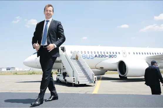  ?? CHRISTOPHE MORIN/BLOOMBERG ?? Guillaume Faury, Airbus president of commercial aircraft, helps introduce Tuesday the A220, which was rebranded from Bombardier’s C Series jet, in Toulouse, France. The European airplane maker, which took a majority stake in the C Series program...