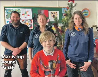  ?? ?? Mac McArdle has been named Young Naturalist of the Year by Arran Ranger Service and is seen here with rangers Jake Dove, Kate Sampson and Corinna Goeckeritz after receiving his trophy. Full story page 3.