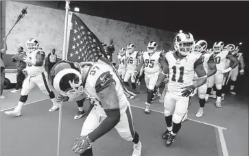  ?? Robert Gauthier Los Angeles Times ?? THE RAMS head onto the Coliseum field for their game against the Texans. With the combinatio­n of their performanc­e and the overall atmosphere, it was arguably the best game in L.A. since their return.