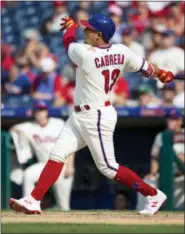  ?? LAURENCE KESTERSON — THE ASSOCIATED PRESS ?? Asdrubal Cabrera launches his game-winning two-run homer in the eight inning Sunday afternoon. The addition of Cabrera and the versatilit­y of Odubel Herrera have deepened the batting order.