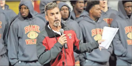  ?? Jeremy Stewart / RN-T ?? Rome High head coach John Reid talks to the fans at a community pep rally while his team stands behind him Thursday at Barron Stadium.