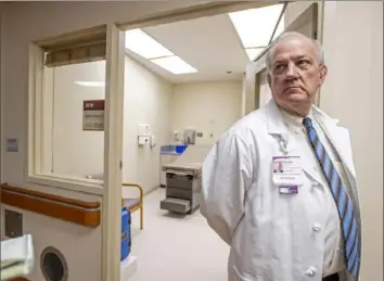  ?? Steph Chambers/Post-Gazette ?? Dr. Don Yealy, UPMC’s chair of emergency medicine, gives a tour of UPMC Mercy’s South Side Outpatient Center, now being used as a COVID-19 collection site, on March 14.