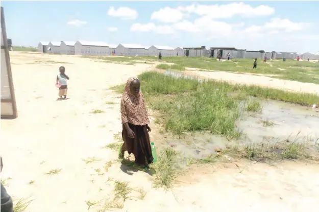 ??  ?? Children wandering around Bakassi Camp in Maiduguri