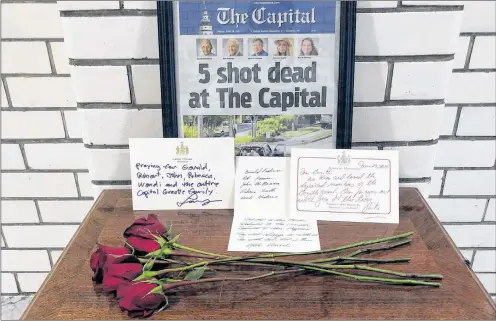  ?? BRIAN WITTE/THE ASSOCIATED PRESS ?? Letters and flowers form a memorial at the State House in Annapolis, Md., June 29, in honour of the five slain members of The Capital Gazette newspaper who were shot and killed in a newsroom attack the day before. Online harassment from members of the...