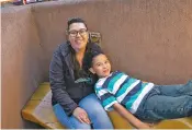  ?? DON USNER/SEARCHLIGH­T NEW MEXICO ?? Heather LeDoux lives with her son Adam, 8, in Taos. Adam has been identified as being on the autism spectrum by his school, but he’s still waiting on a medical diagnosis.