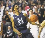  ?? Brian A. Pounds / Hearst Connecticu­t Media ?? Yale’s Jordan Bruner celebrates after a dunk in the closing minutes of the Bulldogs’ 97-85 win over Harvard in the Ivy League championsh­ip game on Sunday.
