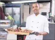  ??  ?? FIRE ON THE WATER: Chef Sphesihle Ndlovu from Cafe Skyzer in Chestervil­le has been practising his open flame skills.