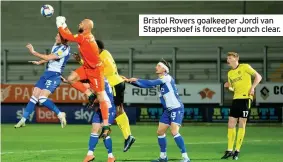  ??  ?? Bristol Rovers goalkeeper Jordi van Stappersho­ef is forced to punch clear.