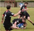  ??  ?? Nottingham Outlaws playercoac­h Adam Cunliffe with the ball against New Earswick All Blacks