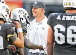  ?? STEPHEN M. DOWELL / ORLANDO SENTINEL ?? UCF head coach Scott Frost says “it’s been a little insane to get this good this quickly,” crediting hard-working freshmen and sophomores.