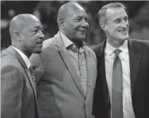  ?? David Zalubowski, The Associated Press ?? From left, former Nuggets Fat Lever, Alex English and Bill Hanzlik pose for a photograph before a Nuggets game last year.