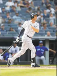  ?? Jim McIsaac / Getty Images ?? The Yankees’ Greg Bird follows through on an eighth- inning home run against the Toronto Blue Jays at Yankee Stadium on Saturday.