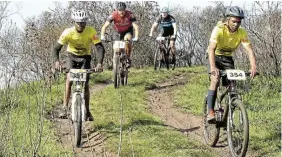  ?? Pictures: SID PENNEY ?? DASHING YELLOW: Two yellow-shirted members of the AmaRiders Cycling Club lead two other riders down the southern side of Mountain Drive to the Woesthill Pass during last month’s G2C mountain bike race from Makhanda to Port Alfred. Akhona Qungathi (351, left) finished the 58km race in 32nd position and Lelethu Mdemna (354, right) 47th. Also among the 107 finishers was the AmaRiders’ founder Antony Wannell.
