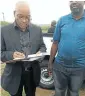  ??  ?? Jacob Zuma signs for the cattle as AgriDeligh­t official Blessing Segano looks on. On the right a Bonsmara bull similar to the one Zuma received.