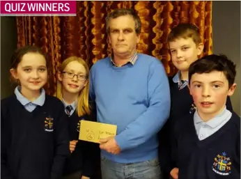  ??  ?? Enda Barr, Chairperso­n Cooley Crerdit Union presents prizes to the U11 Schools Quiz winners from Naoimh Mhuire, Boher: Eabha Davidson, Lara Du Plessis, Matthew Brady and Aaron Byrne.
