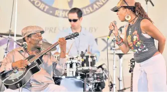  ?? Photo — AFP file ?? Peterson (left) and his wife Tamara perform at the Newport Jazz Festival in Newport, Rhode Island.