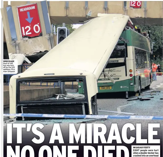  ??  ?? WRECKAGE Roof of 14ft bus was torn off by the 12ft walkway. Pics: Alan Simpson