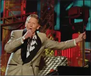  ?? (AP/Mark Duncan, file) ?? Jerry Lee Lewis finishes his set with Bruce Springstee­n and the E Street Band at the Concert for the Rock and Roll Hall of Fame in this September 2, 1995 file photo at Cleveland Stadium.