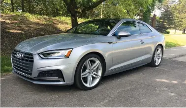  ?? (Robert Duffer/Chicago Tribune/TNS)) ?? Redesigned for 2018, the second-generation Audi A5 Coupe uses a 2-liter turbocharg­ed 4-cylinder engine mated to a 7-speed transmissi­on to make 252-horsepower and 273 pound-feet of torque. It seats four (two comfortabl­y) and its Virtual Cockpit should...