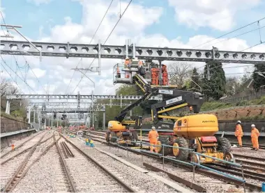  ?? NETWORK RAIL. ?? OLE work is completed near Shenfield as part of Crossrail’s eastern surface works on April 16 2017. NR has targeted a 10% reduction during CP6 in the unit cost of renewals including electrific­ation, and ORR’s Draft Determinat­ion for CP6 has taken a...