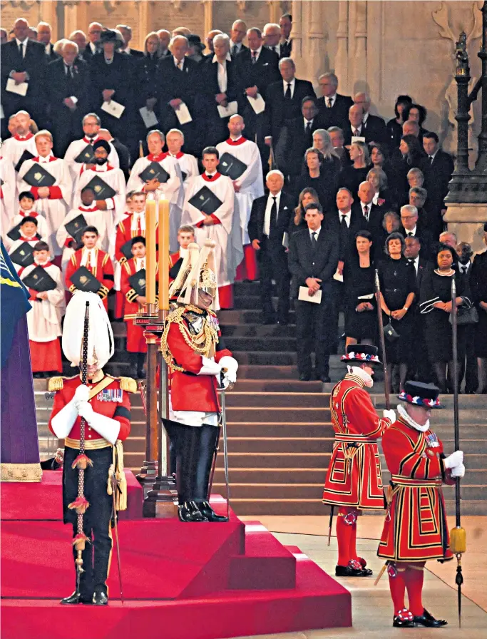  ?? ?? Queen Elizabeth II’S coffin was placed in Westminste­r Hall yesterday
