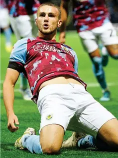  ?? REX ?? Slide rule: Burnley’s Harwood-Bellis celebrates his goal