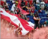  ?? JULIO CORTEZ — THE ASSOCIATED PRESS FILE ?? Red Bulls supporters celebrate a goal in a match against the Montreal Impact in Harrison, N.J. The Red Bulls unveiled a special room at the team’s stadium last season to welcome fans with autism, providing a quiet space from crowd noise and other...