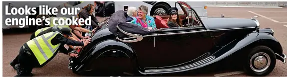  ?? ?? Looks like our engine’s cooked
Push! Dame Prue Leith found herself in a spot of bother when her vintage Jaguar came to a splutterin­g halt and had to be rescued