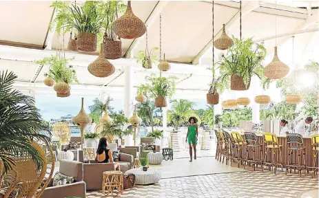  ?? /Supplied ?? Perfect place to unwind: The enchanting Palm Court Bar at the refurbishe­d LUX* Grand Gaube resort in Mauritius. Chief sales and marketing officer Julian Hagger says the group launched a campaign three years ago to attract more of SA’s black upper- and...