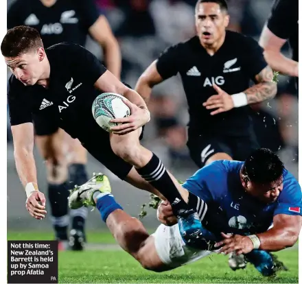  ?? PA ?? Not this time: New Zealand’s Barrett is held up by Samoa prop Afatia