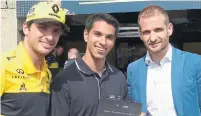  ?? JIM KENZIE FOR THE TORONTO STAR ?? Renault F1 driver Carlos Sainz Jr., left, Chase Pelletier and Tommaso Volpe, director of Infiniti Global Motorsport projects.