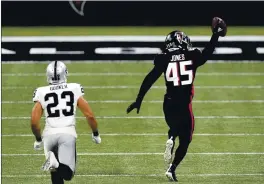  ?? JOHN BAZEMORE — THE ASSOCIATED PRESS ?? Turnovers like this intercepti­on return for a touchdown by Falcons linebacker Deion Jones (45) last month have been tough for the Raiders to overcome this season.