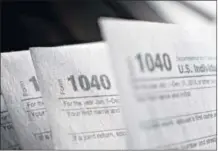  ?? DANIEL ACKER / BLOOMBERG ?? Two tax credits available to families with children in school — the American Opportunit­y Tax Credit and the Lifetime Learning Credit — are credits that families can subtract in full from their federal income tax bill, not just deduct from taxable income.