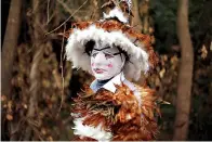  ?? AP Photo/Jorge Saenz ?? ■ Four-year-old Josia Sebastian Yegros poses for a photo wearing his feathered costume Wednesday during the feast of St. Francis Solano in Emboscada, Paraguay.