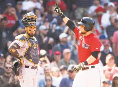  ?? Kathryn Riley / Getty Images ?? Michael Chavis of the Red Sox celebrates after hitting a solo home run in the fifth inning of Sunday’s game against the Astros at Fenway Park in Boston.