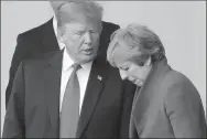  ?? LUDOVIC MARIN VIA REUTERS ?? US President Donald Trump talks to UK Prime Minister Theresa May in a photo taken ahead of the opening of the NATO summit, at the NATO headquarte­rs in Brussels, Belgium, on Wednesday.