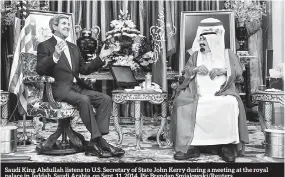  ??  ?? Saudi King Abdullah listens to U.S. Secretary of State John Kerry during a meeting at the royal palace in Jeddah, Saudi Arabia, on Sept. 11, 2014. Pic Brendan Smialowski/Reuters