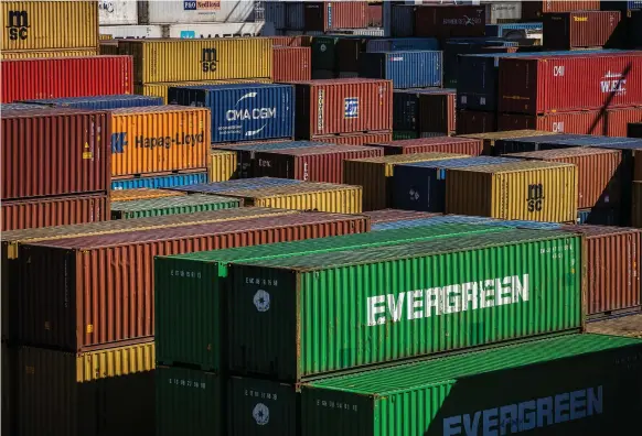  ?? Bloomberg ?? Shipping containers in Porto, Portugal. McKinsey says trade volumes will take 15 to 48 months to recover to levels recorded in the last quarter of 2019