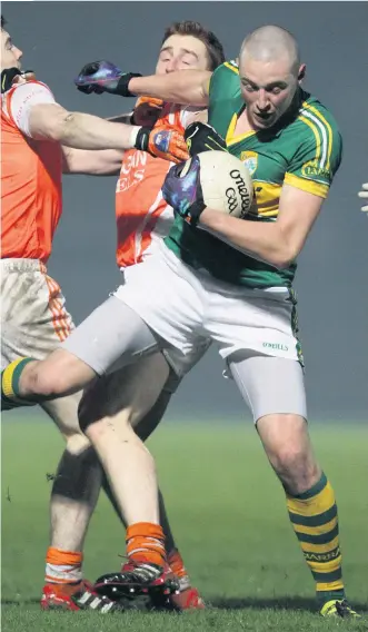  ??  ?? Familiar face: Kieran Donaghy takes on Armagh, who he will now coach, in 2012 with Kerry