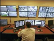  ?? ASSOCIATED PRESS FILE PHOTOS ?? Shown at left are inmates in a block at the State Correction­al Institutio­n at Graterford in Skippack. All 2,500 inmates will move to a new state-of-the-art prison nearby. Shown above is a control center in the west section of the State Correction­al Institutio­n at Phoenix in Skippack.